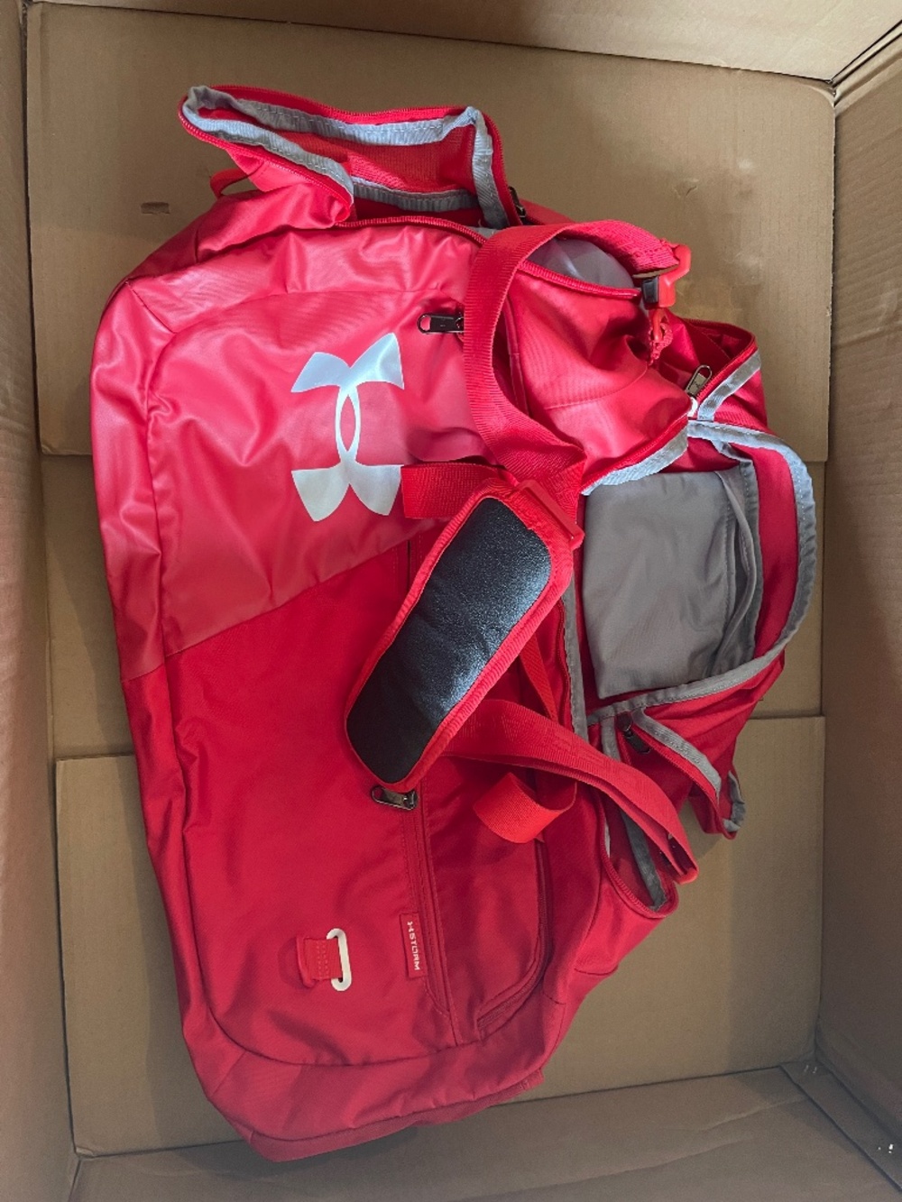 Large Red Under Armour duffel bag.